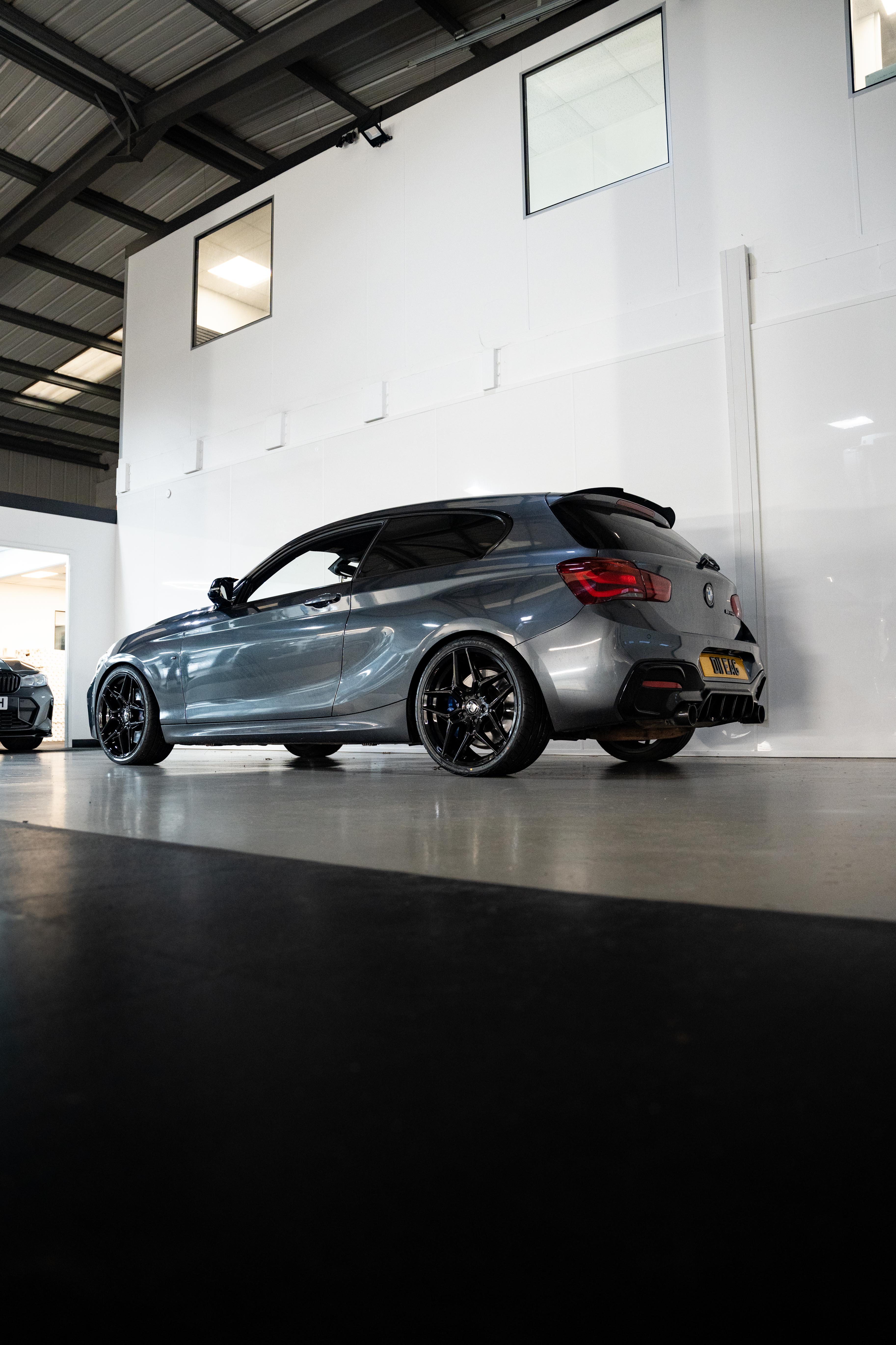 Rear shot of a Grey BMW with Precision Black M-W1 wheels.