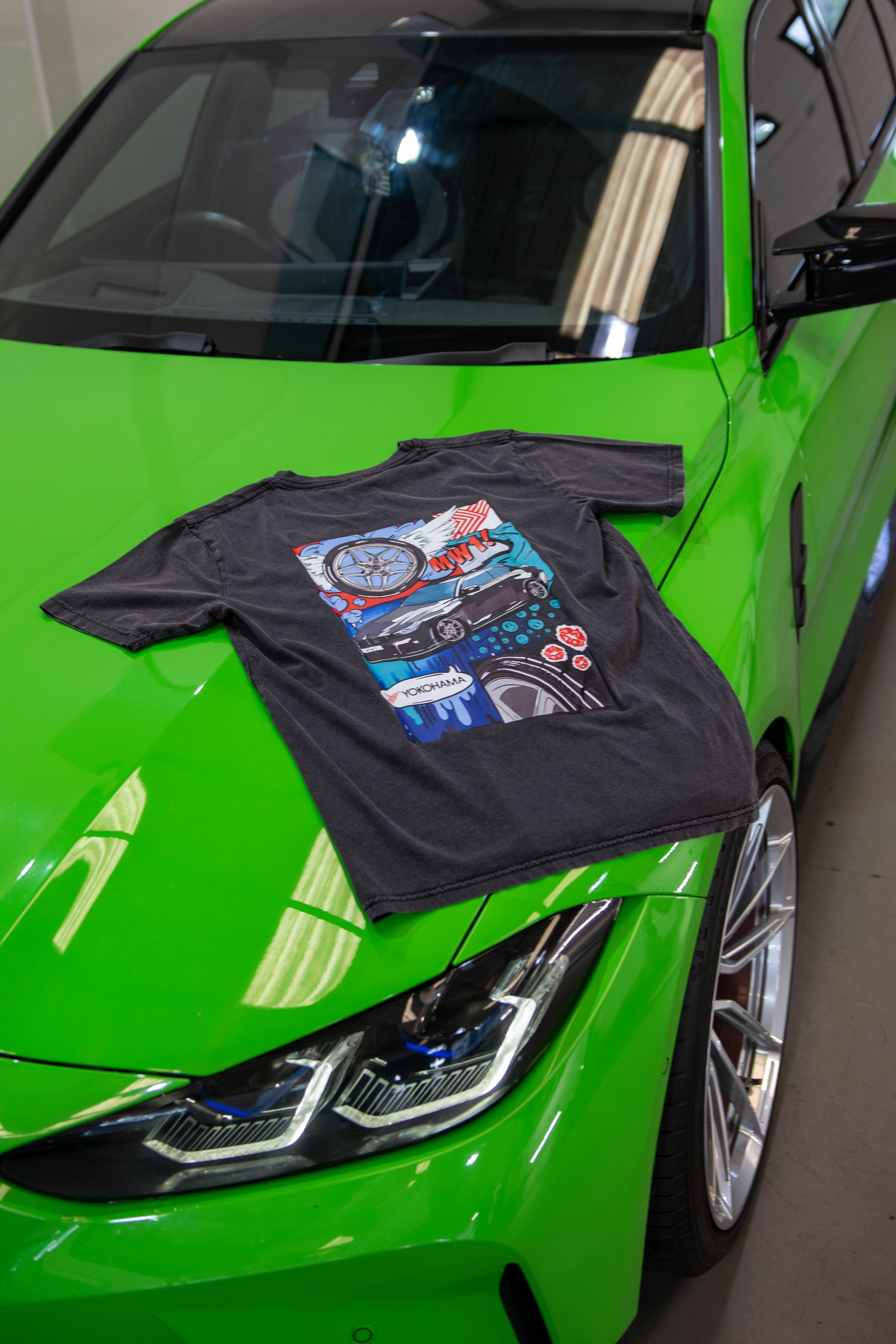 Treadlight Collection Stone Washed T-Shirt with colorful design on a green car