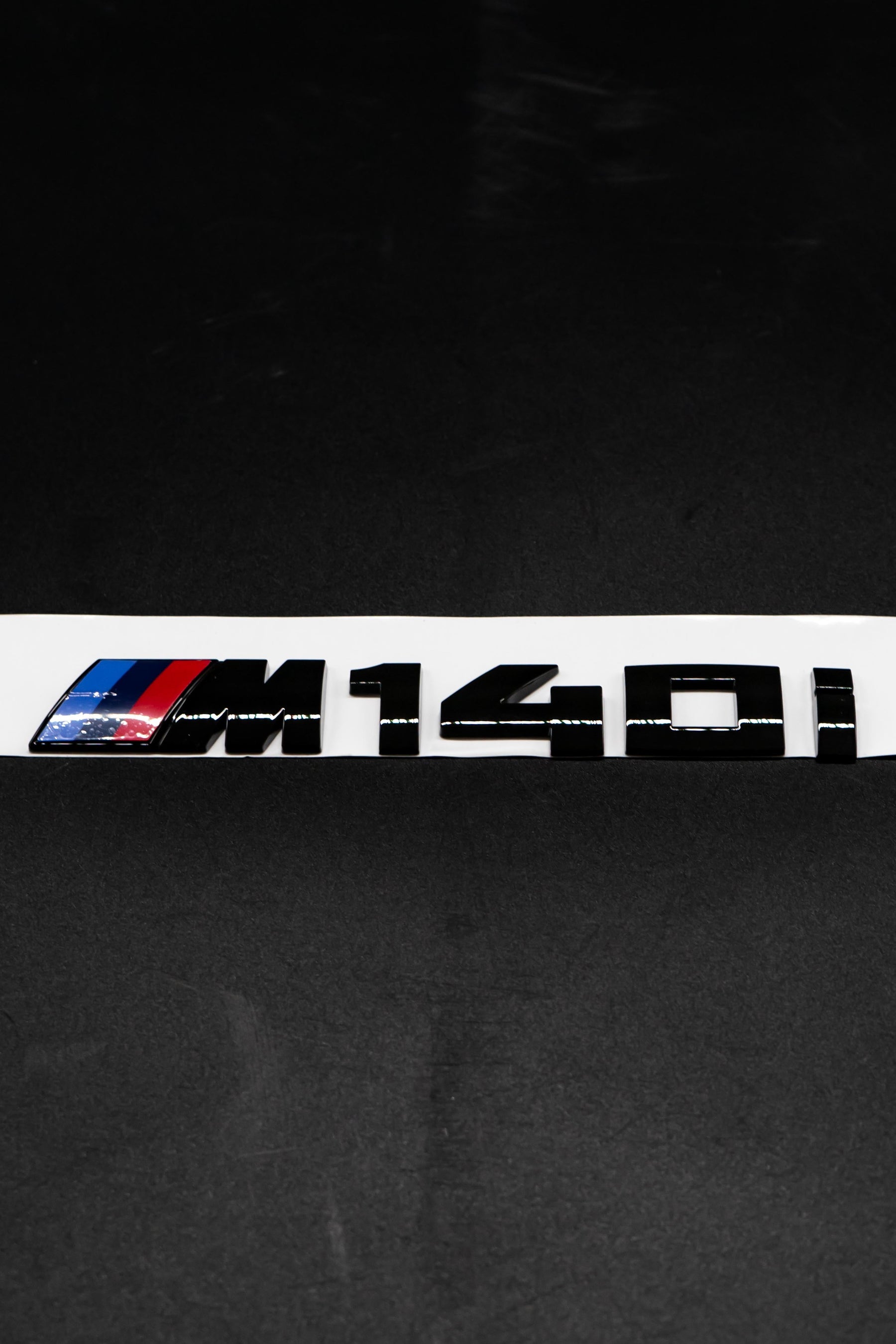 BMW Gloss Black M140i Badge