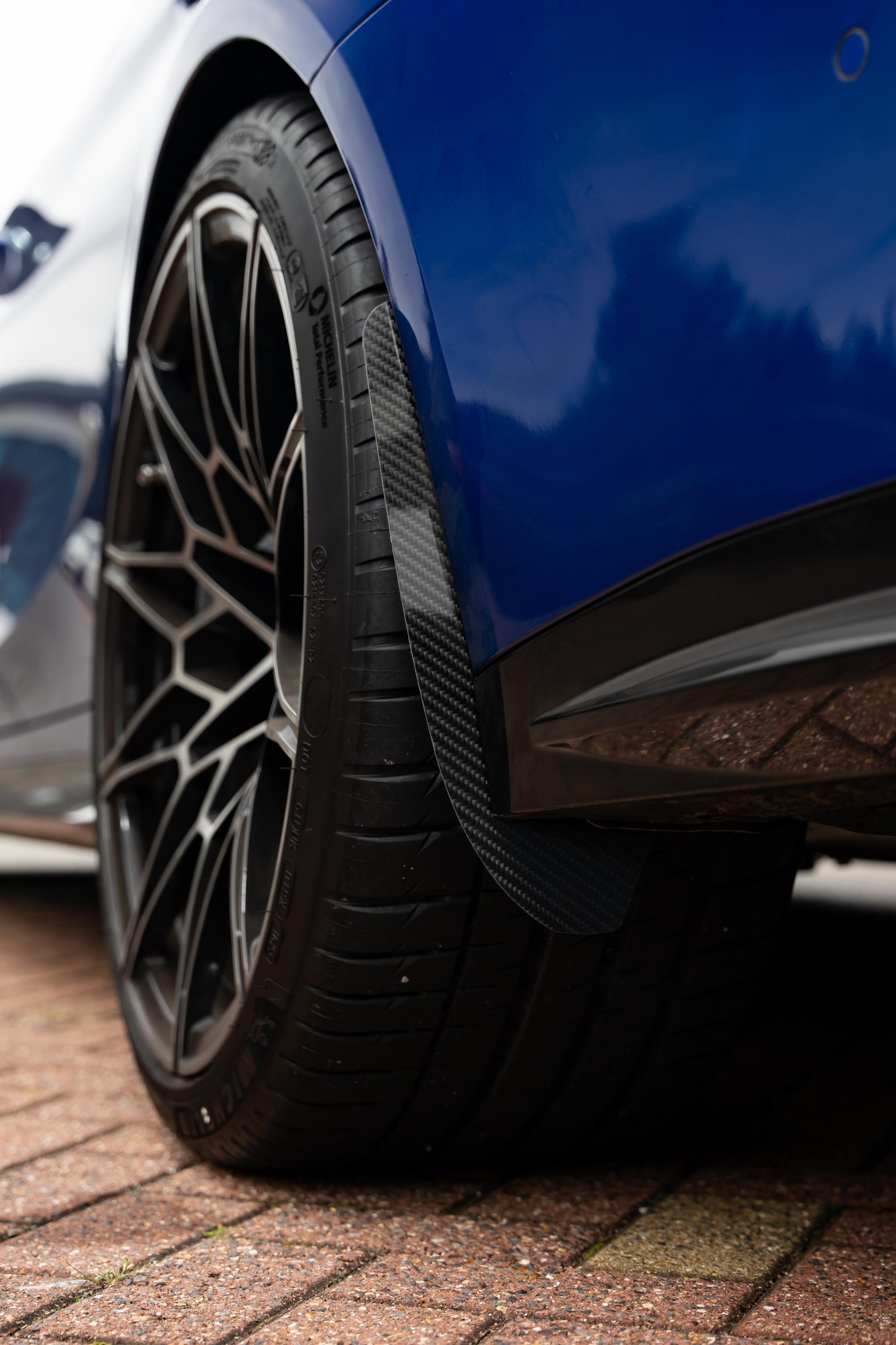 Carbon Arch Guards fitted onto the back of a wheel.