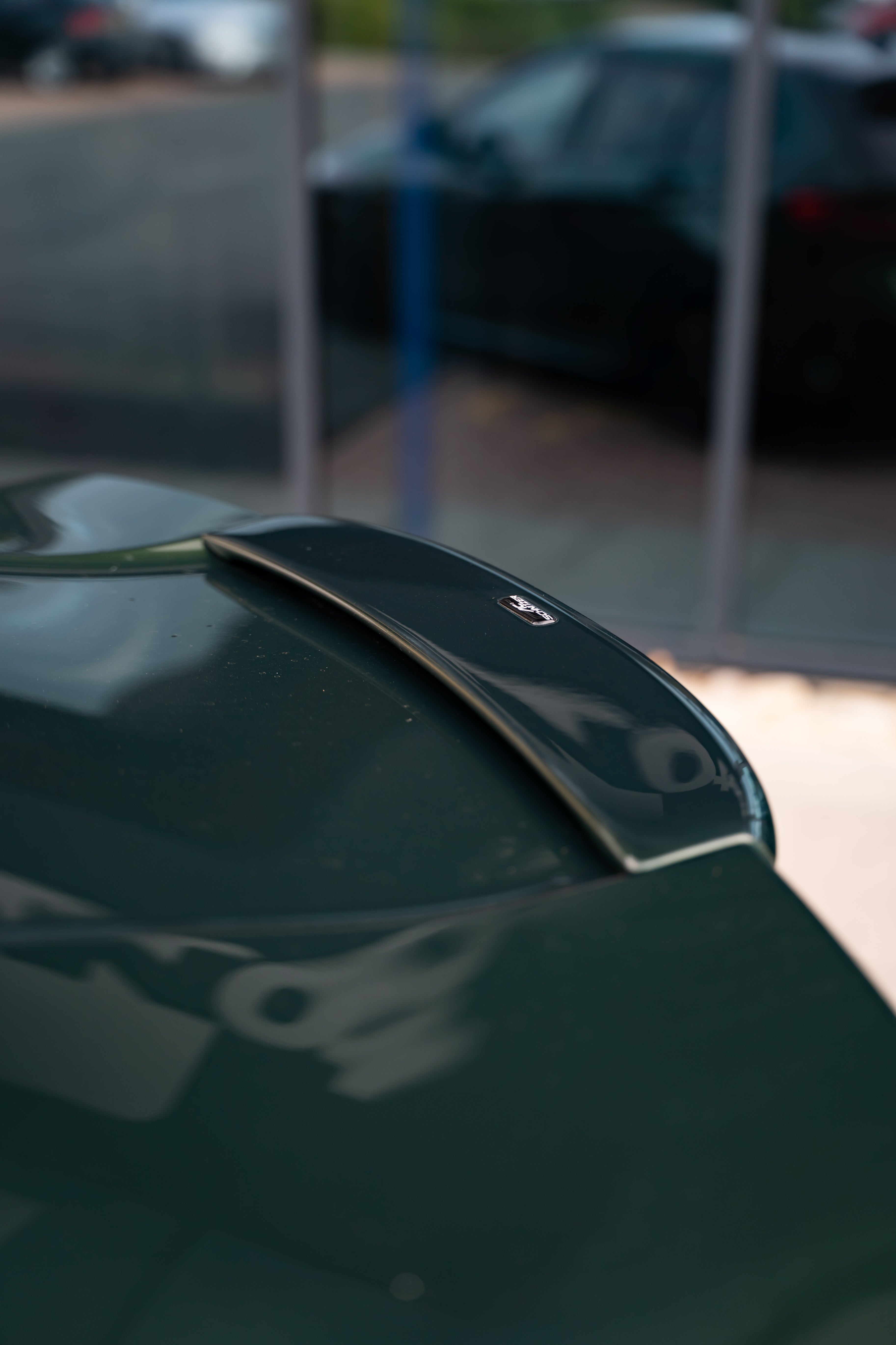 Car spoiler with AC Schnitzer on a blurred background