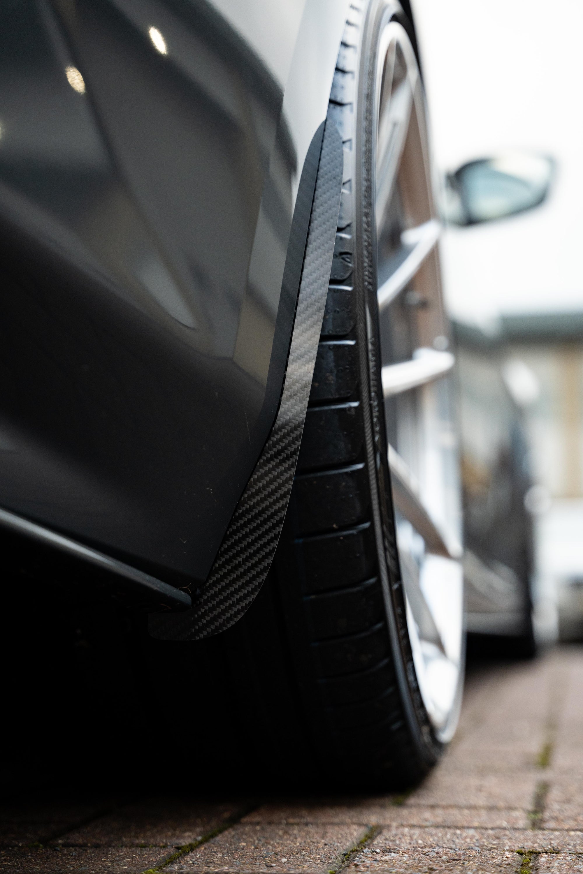 Carbon Arch Guards fitted onto the back of a wheel.