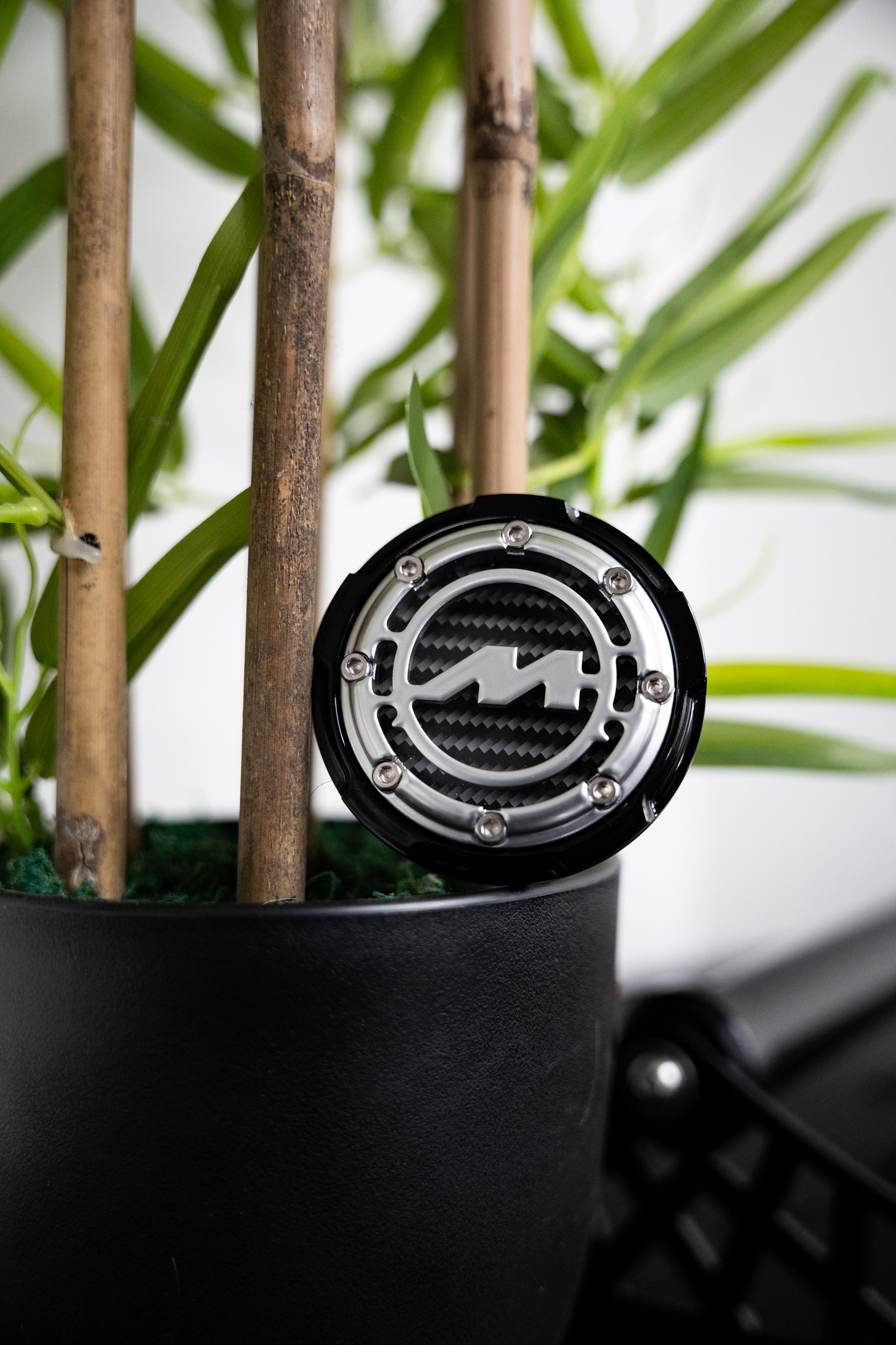 Gloss Polished Motech Centre Cap on a plant pot.