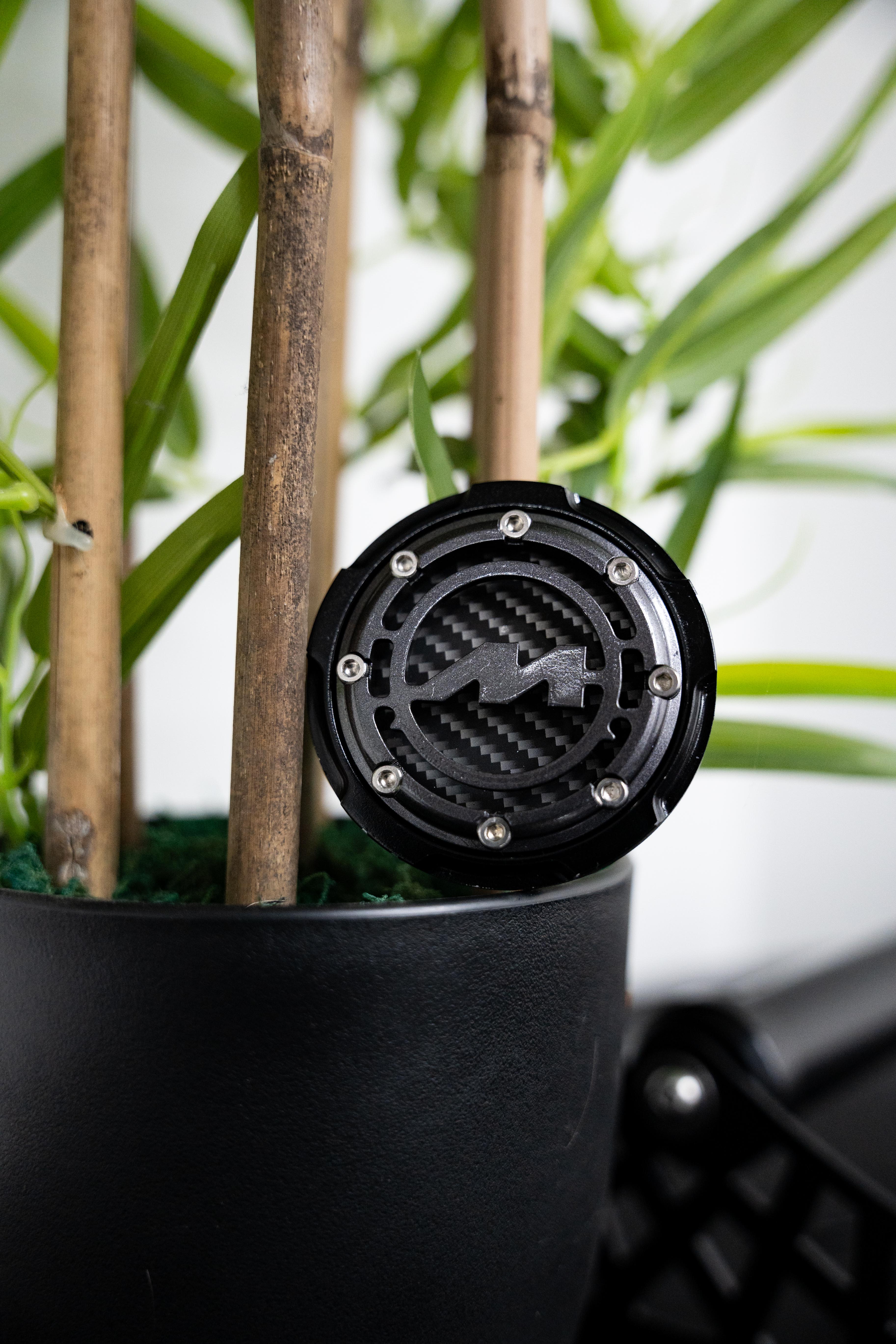 Black Motech Centre Cap on a plant pot.