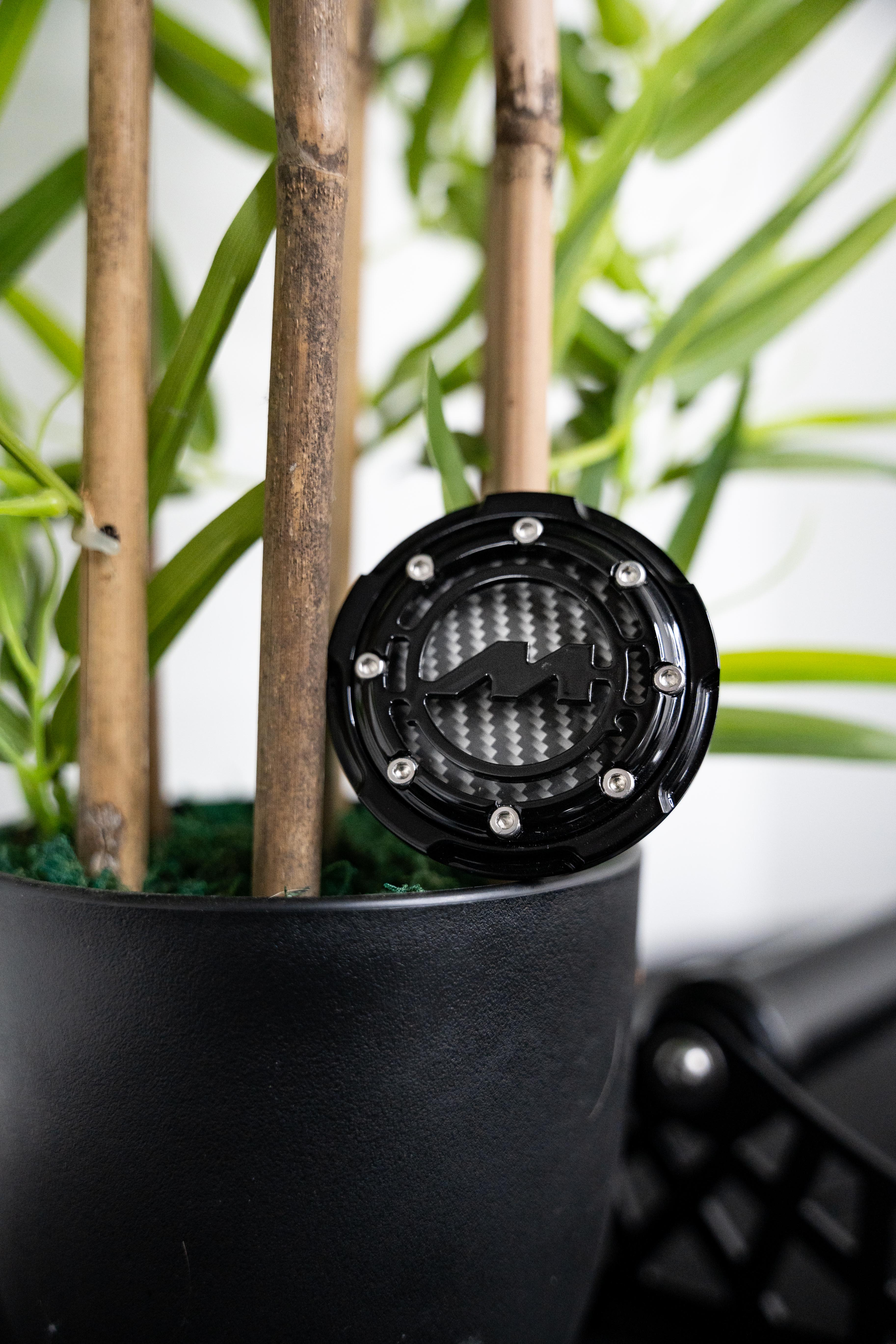 Black Motech Centre Cap on a plant pot.