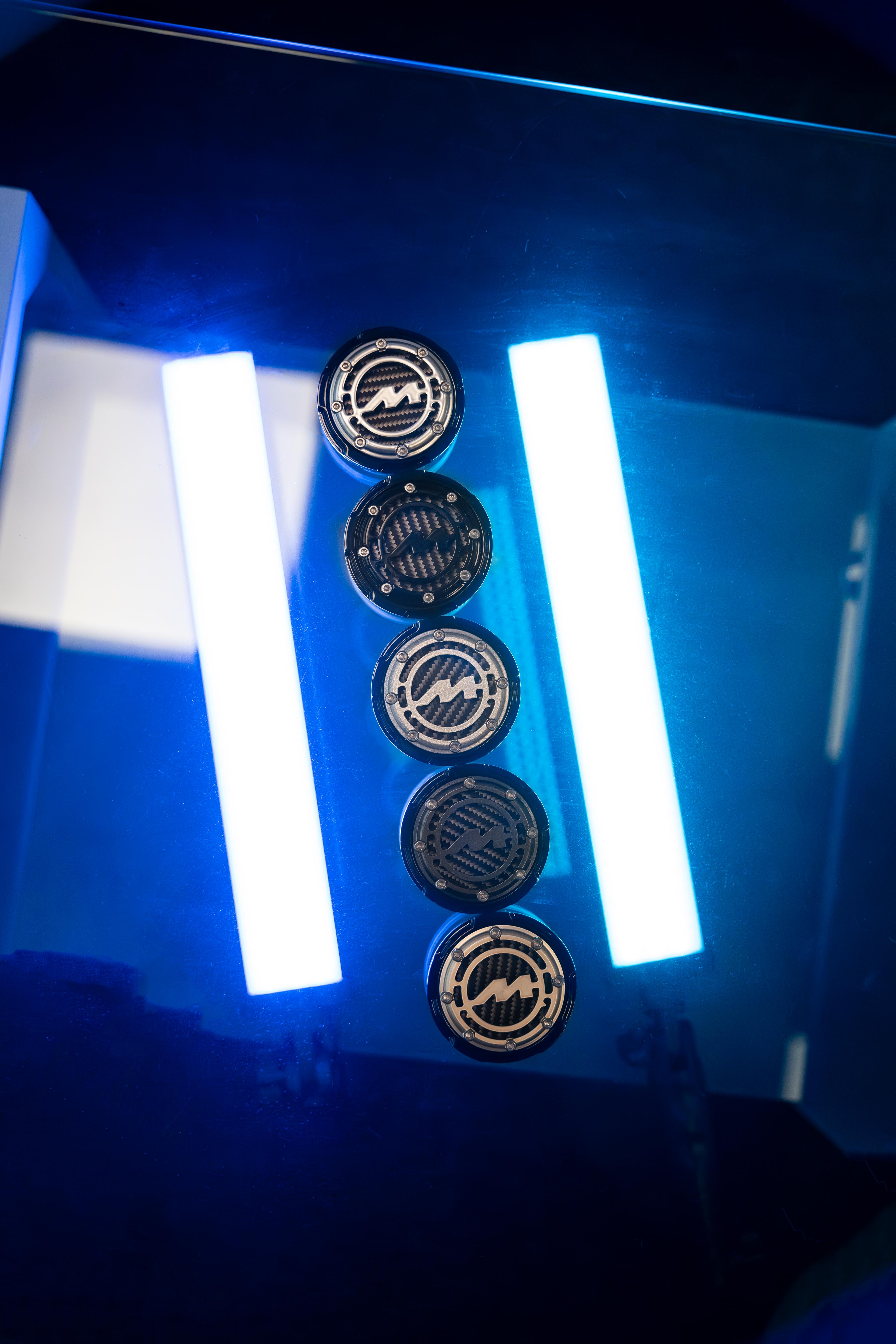 Five Motech Centre Caps lit by blue LED's.