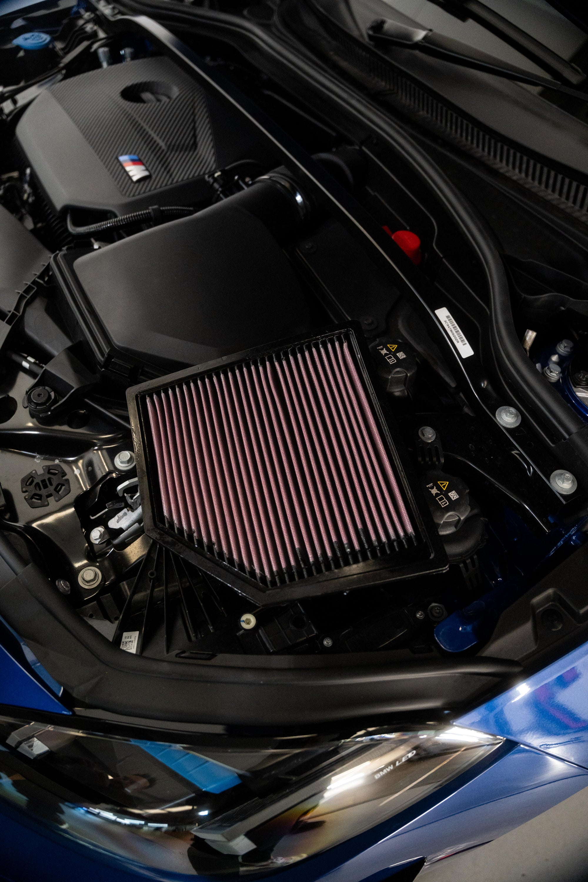 K&N air filter in a BMW engine bay.