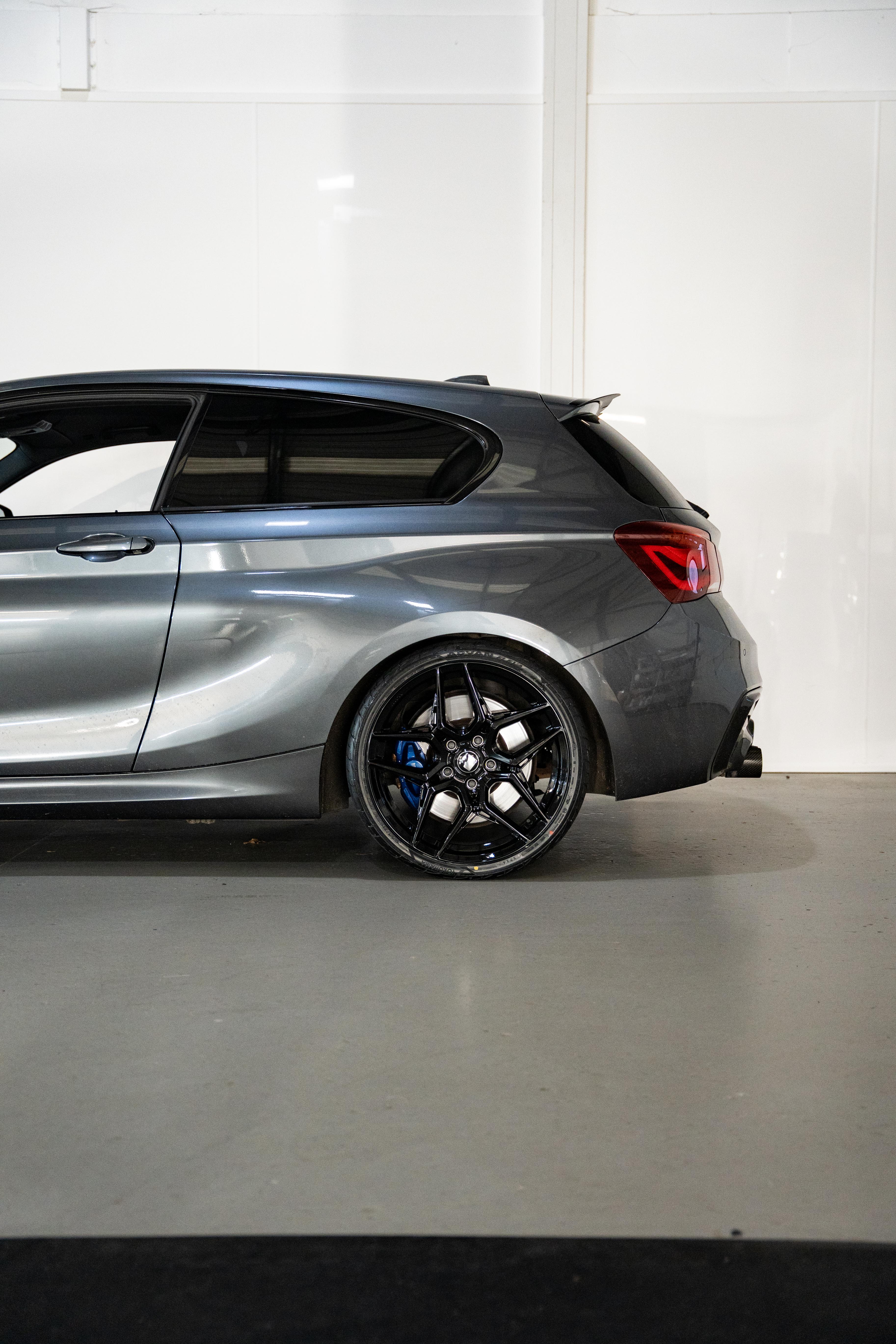 Rear wheel shot of a grey BMW with Precision Black M-W1's.