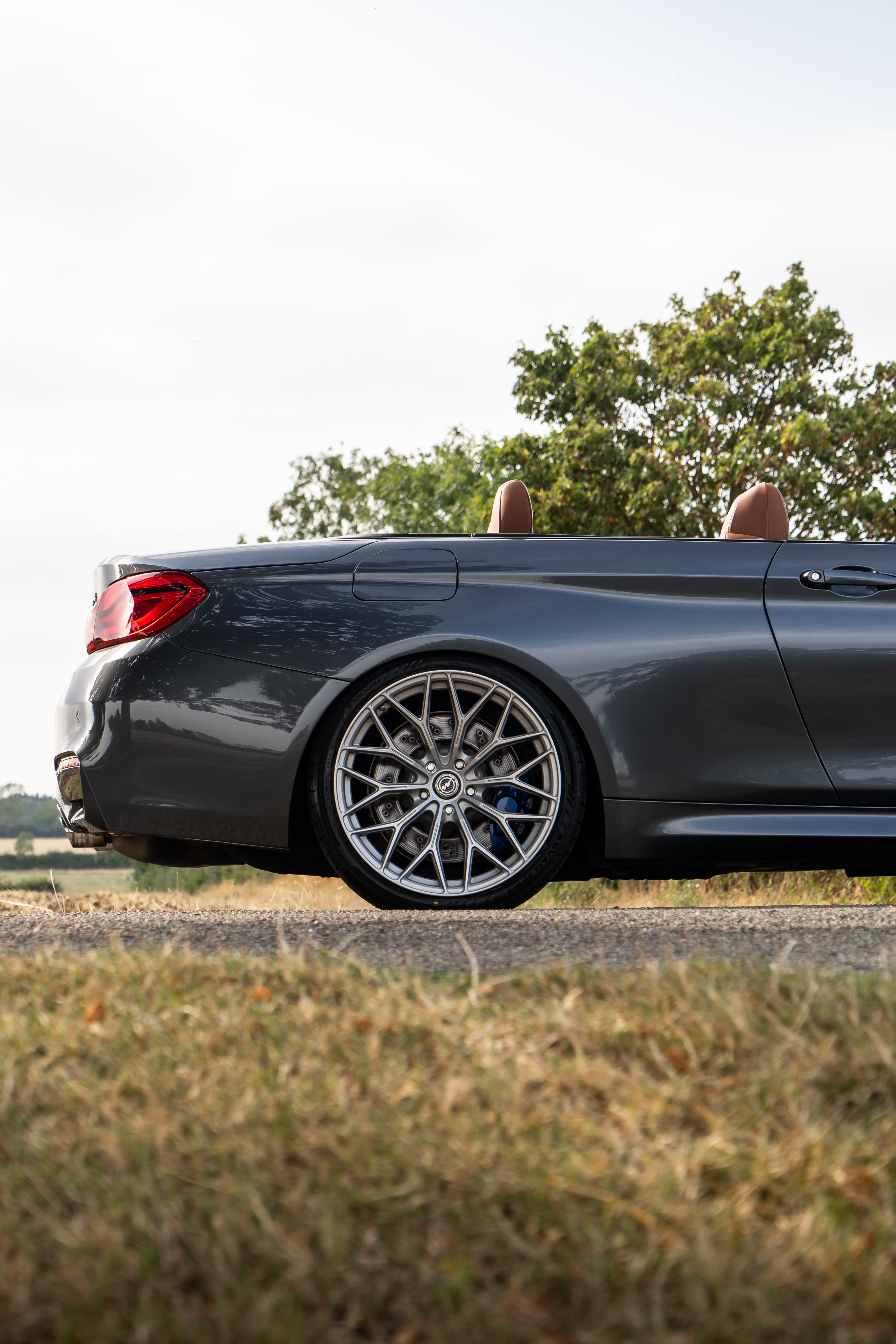 Back of a convertible BMW M4 on Motech Stance Springs. 