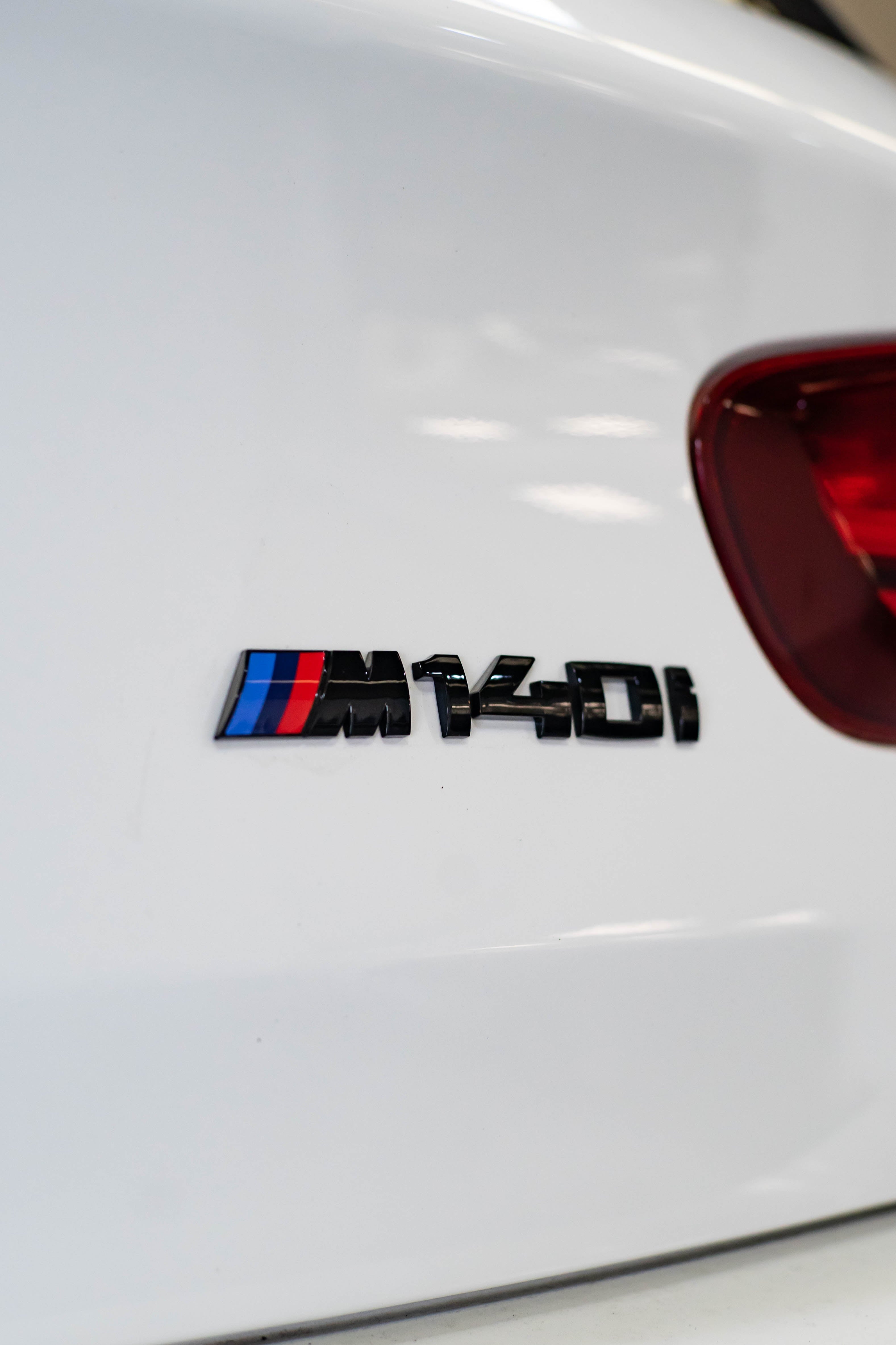 BMW Gloss Black M140i Badge