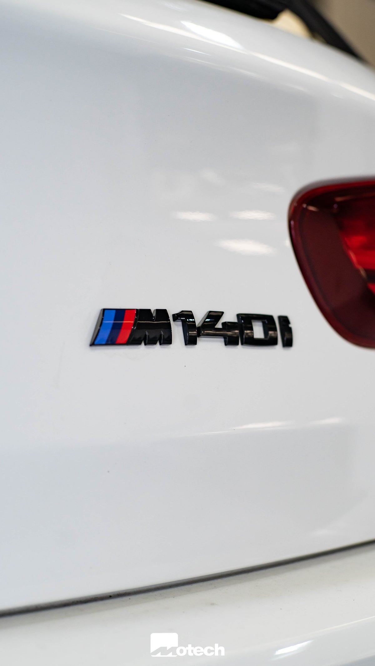 BMW Gloss Black M140i Badge